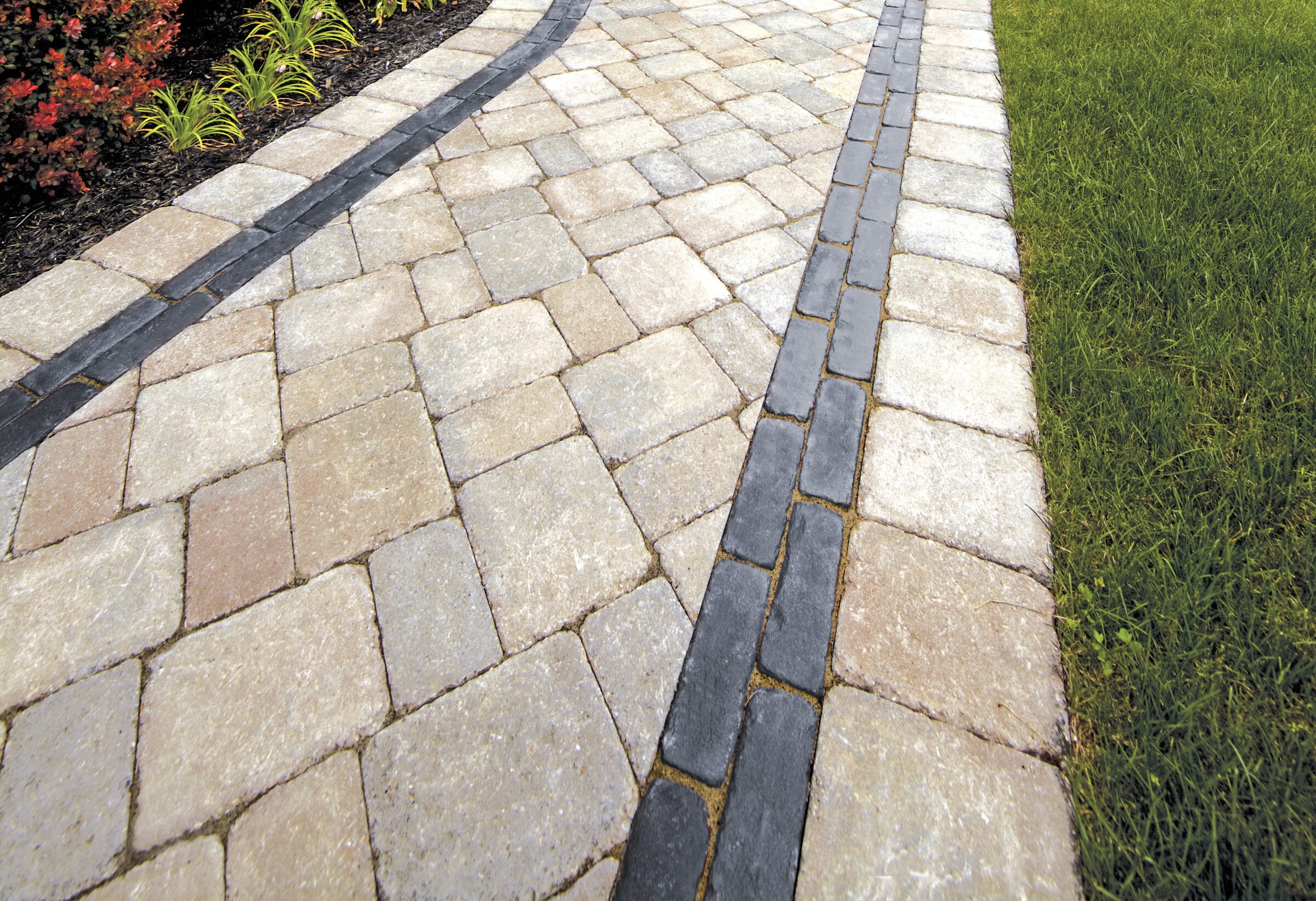 Brick pathway bordered by green grass