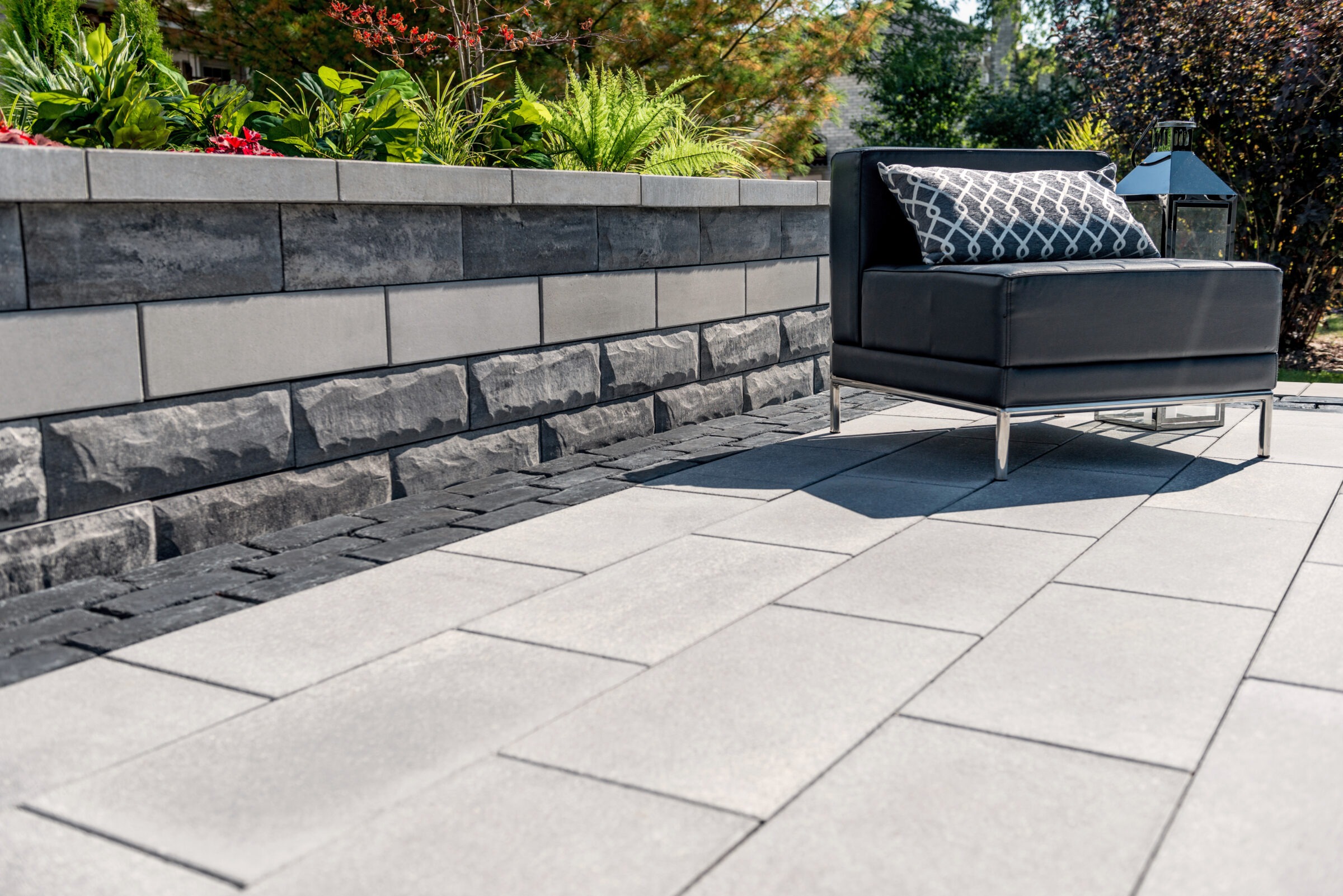 Modern patio chair on paved terrace