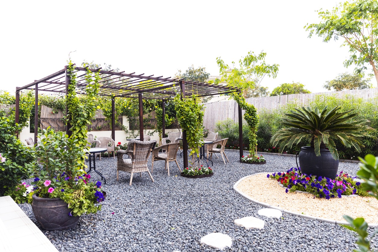 Outdoor garden with pergola and seating area