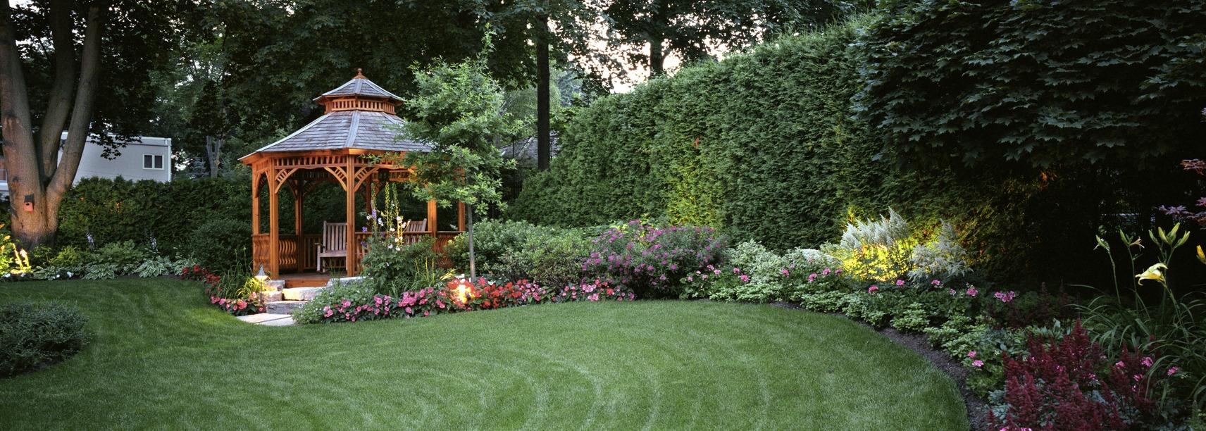 Beautiful garden with gazebo and colorful flowers