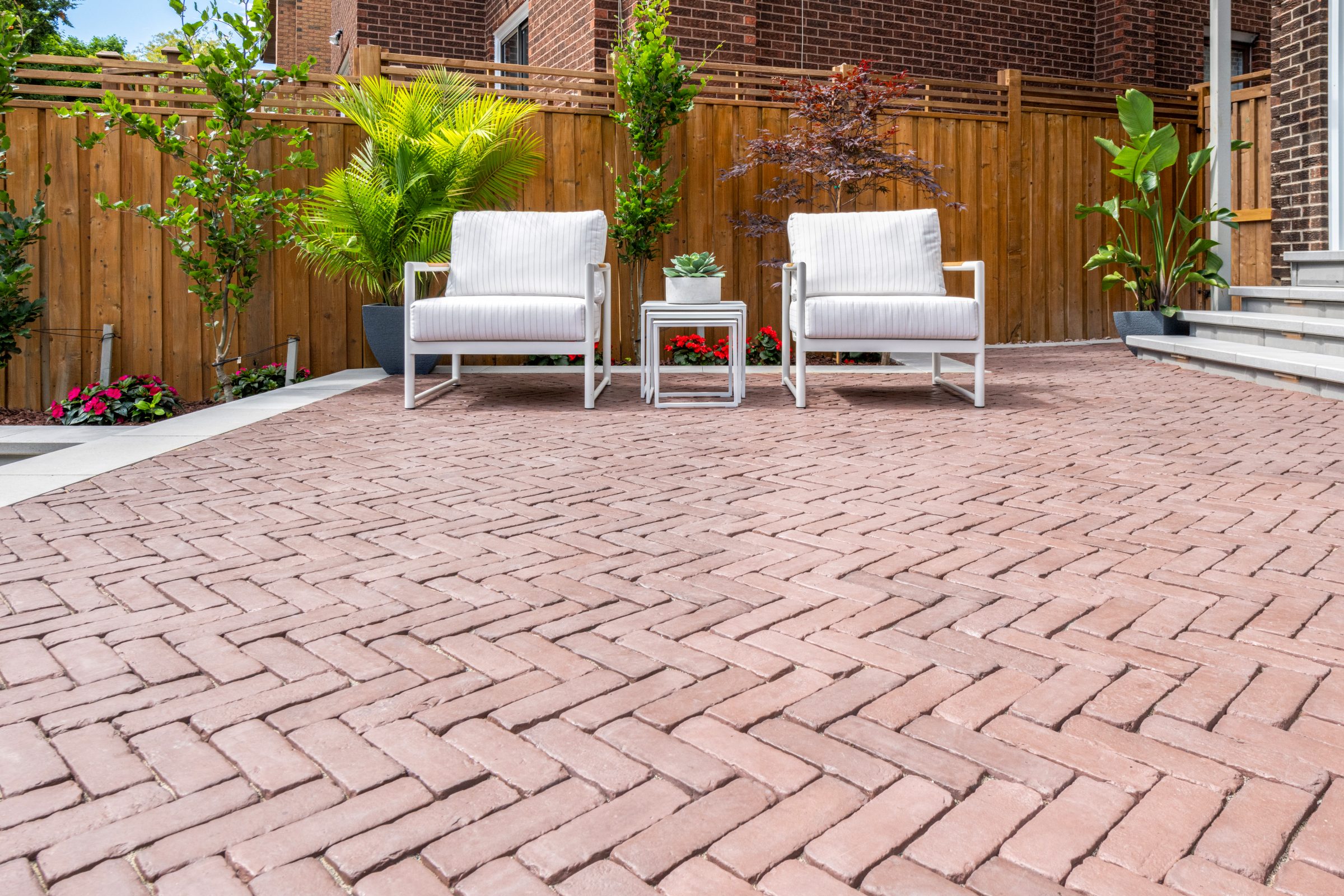 Brick patio with chairs and potted plants