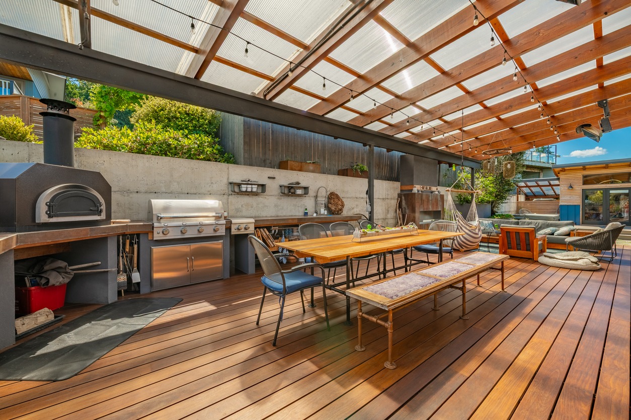 Outdoor kitchen with grill and dining area